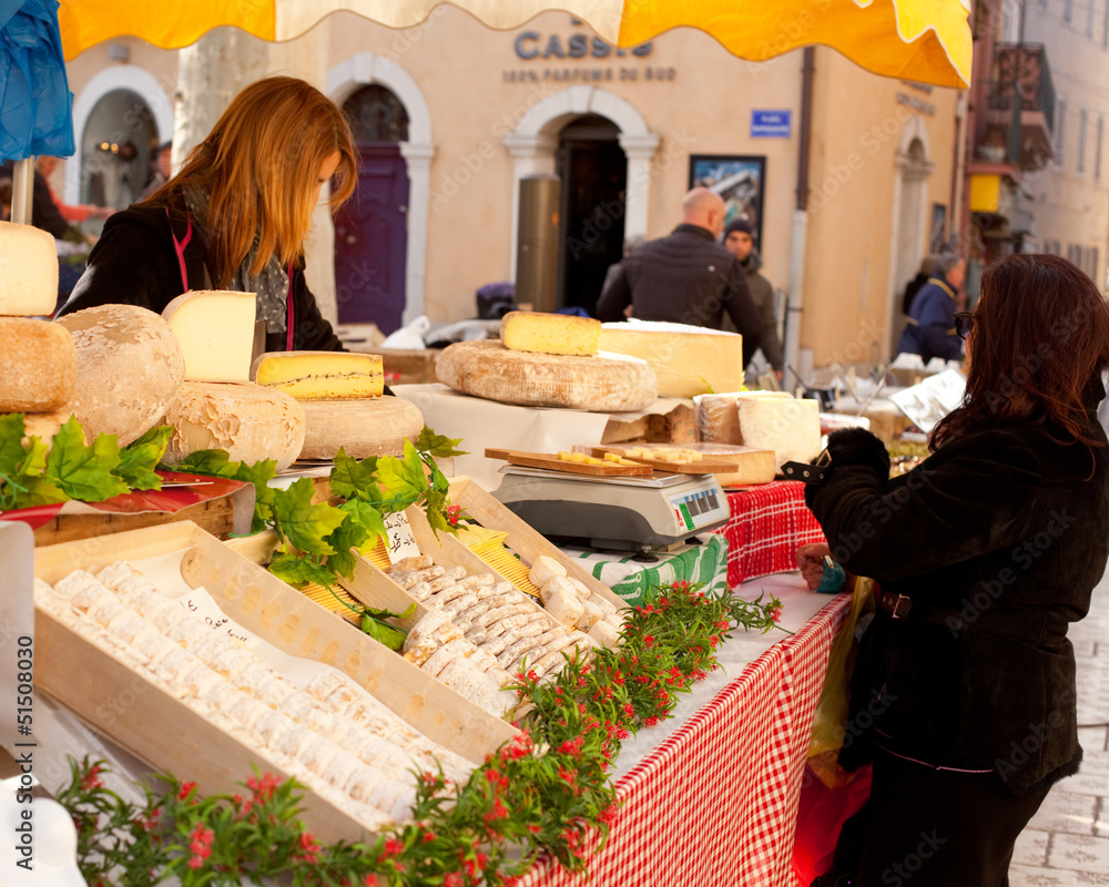 Sale of French cheese in a street market in Cassis