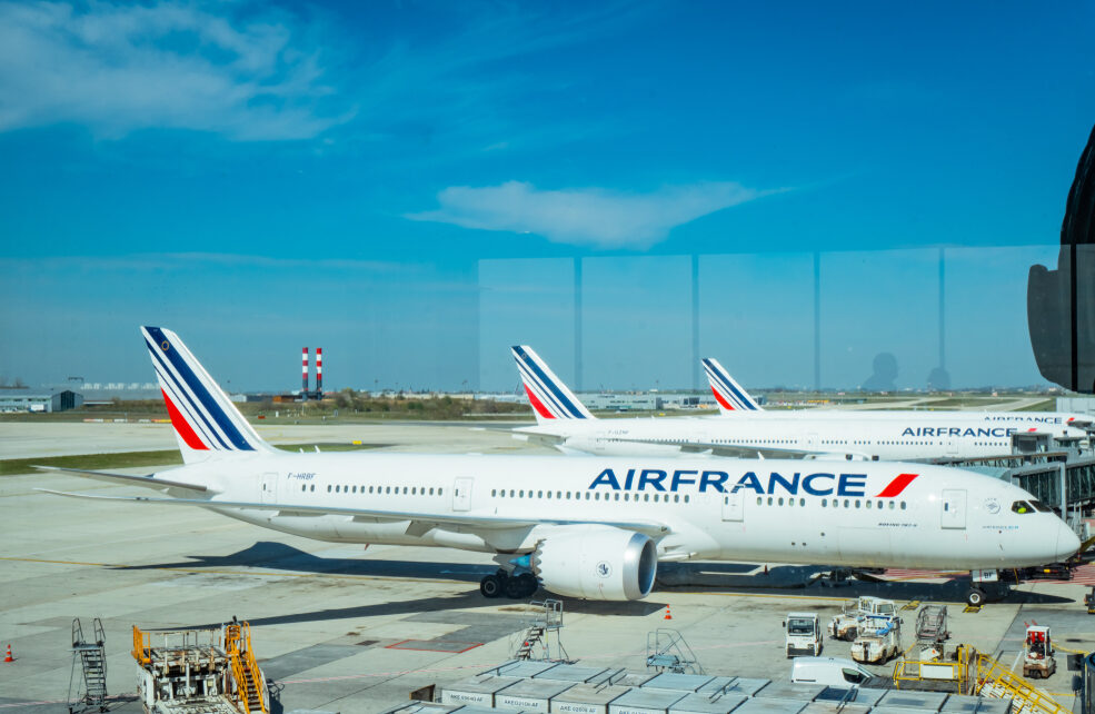 PARIS, FRANCE-MARCH 30, 2019 : Aircraft of Airfrance airline docking at Paris Charles de Gaulle airport. Air France airplane with blue sky and white clouds on sunny day at airport. Commercial airline.