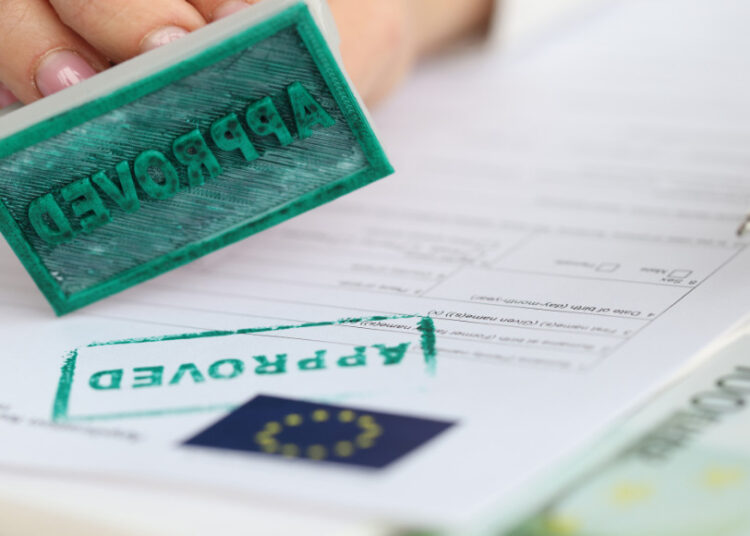 Approval stamp on EU immigration paperwork