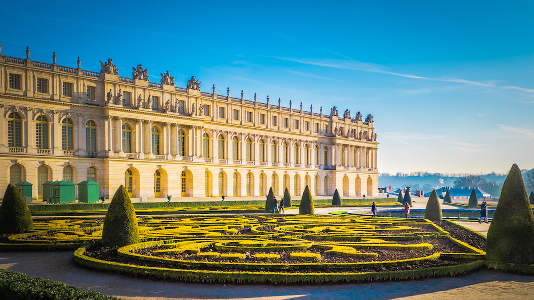 Famous palace Versailles with beautiful gardens outdoors near Paris, France. The Palace Versailles was a royal chateau and was added to the UNESCO list of World Heritage Sites.
