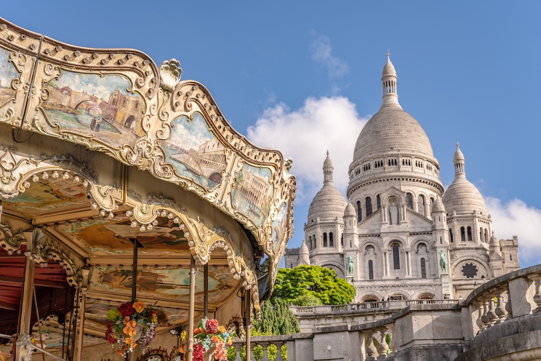 Paris, France - circa May 2022: View of the merry go round on the grounds of the Sacre Coeur in Montmartre.